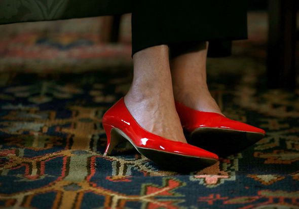 Mrs May added a splash of colour to her meeting at Bute House with these red shoes 