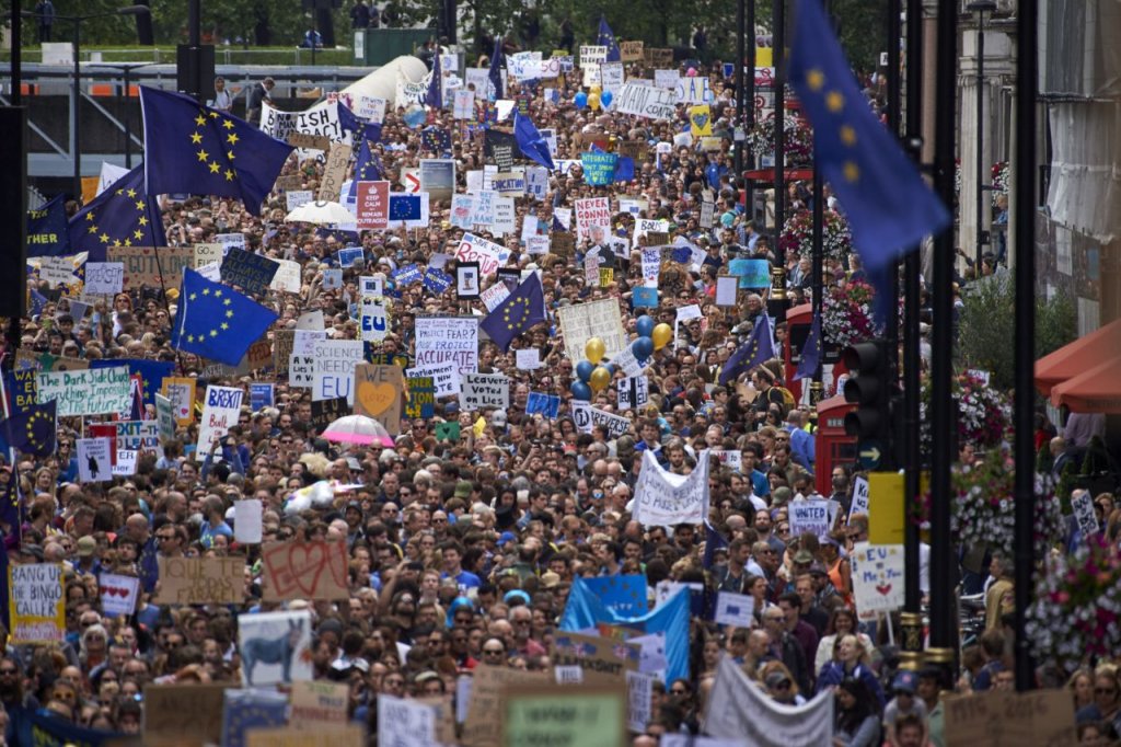People hold up pro-Europe placards and European flags as thousands of protesters take part in a March for Europe, through the centre of London on July 2, 2016, to protest against Britain's vote to leave the EU, which has plunged the government into political turmoil and left the country deeply polarised. Protesters from a variety of movements march from Park Lane to Parliament Square to show solidarity with those looking to create a more positive, inclusive kinder Britain in Europe. / AFP / Niklas HALLE'N (Photo credit should read NIKLAS HALLE'N/AFP/Getty Images)
